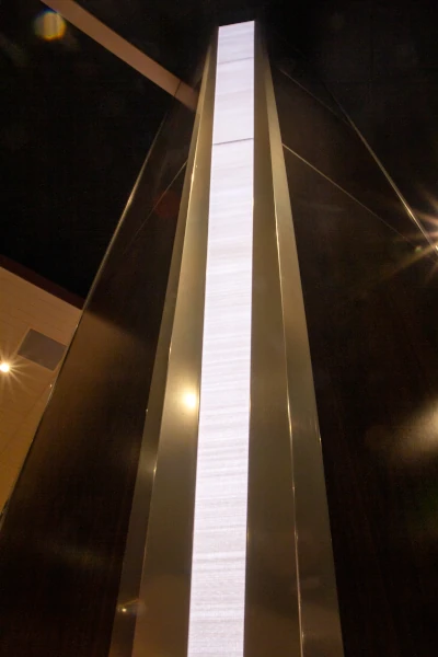 LED, wood, and stainless steel-wrapped pillar detail. 