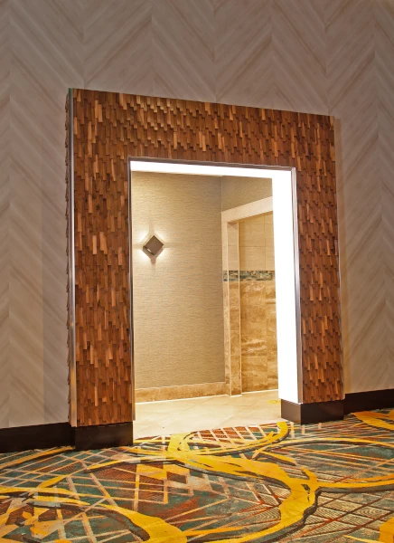 Auburn casino bathroom entryway with distinctive wood cladding by Construction Expeditors. 