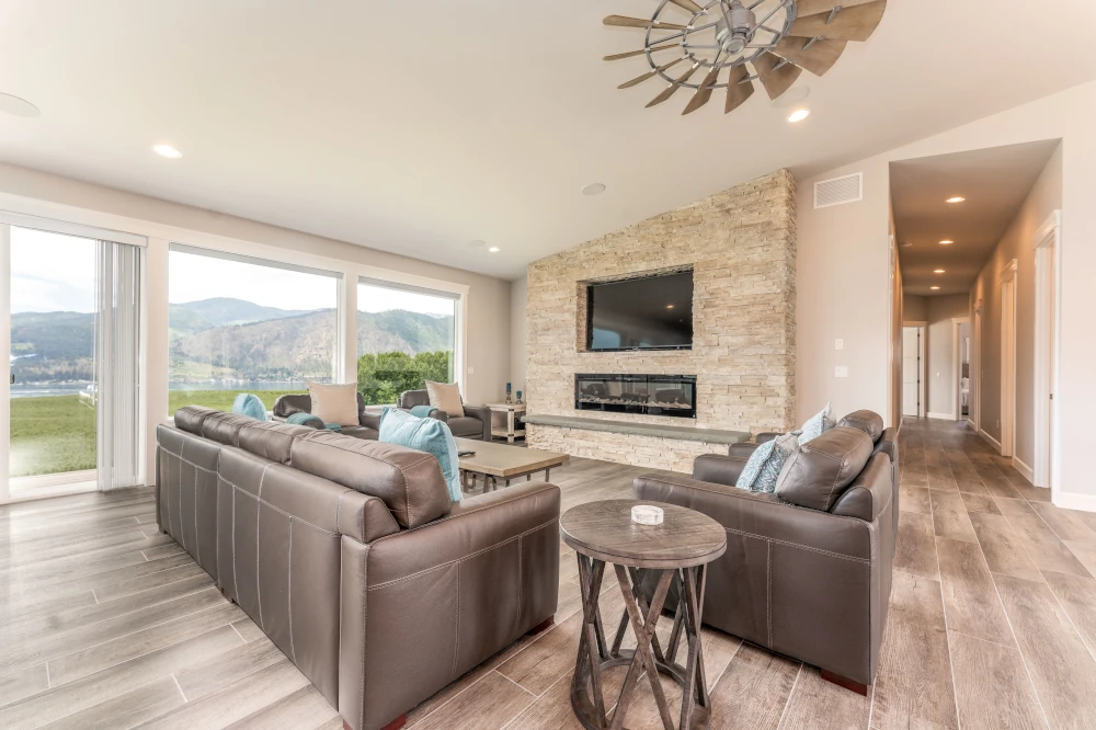 1,600 SF great room with a gas ledger stone fireplace, Lake Chelan, WA.