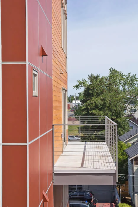 Apartment with a private balcony featuring see-through railings.